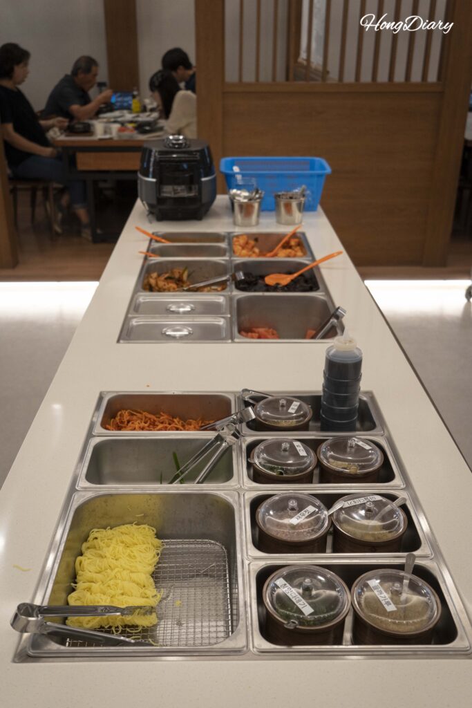 Self-service banchan and white rice station inside Irojeong restaurant in Gumi
