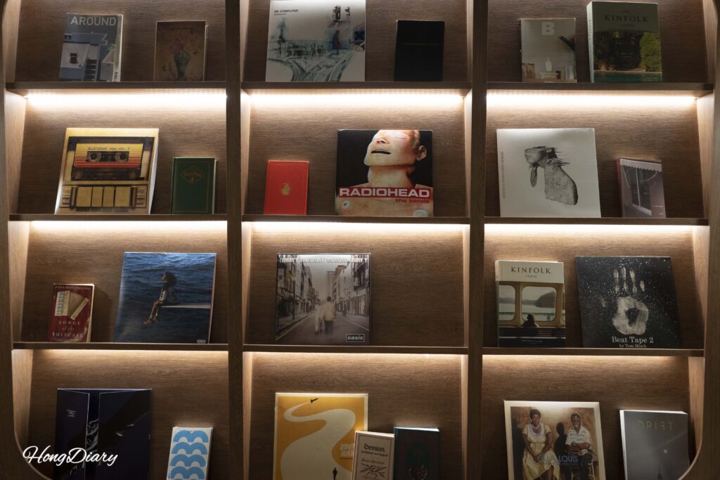 Vintage album covers and retro posters decorating the Kukjejang Hotel lobby wall