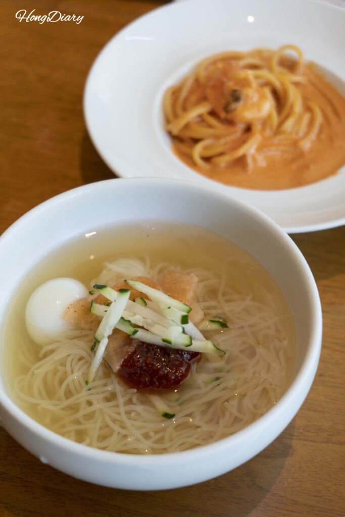 Busan-style milmyeon cold noodles and rosé pasta from the live cooking station at Ristorante, Hotel Nongshim