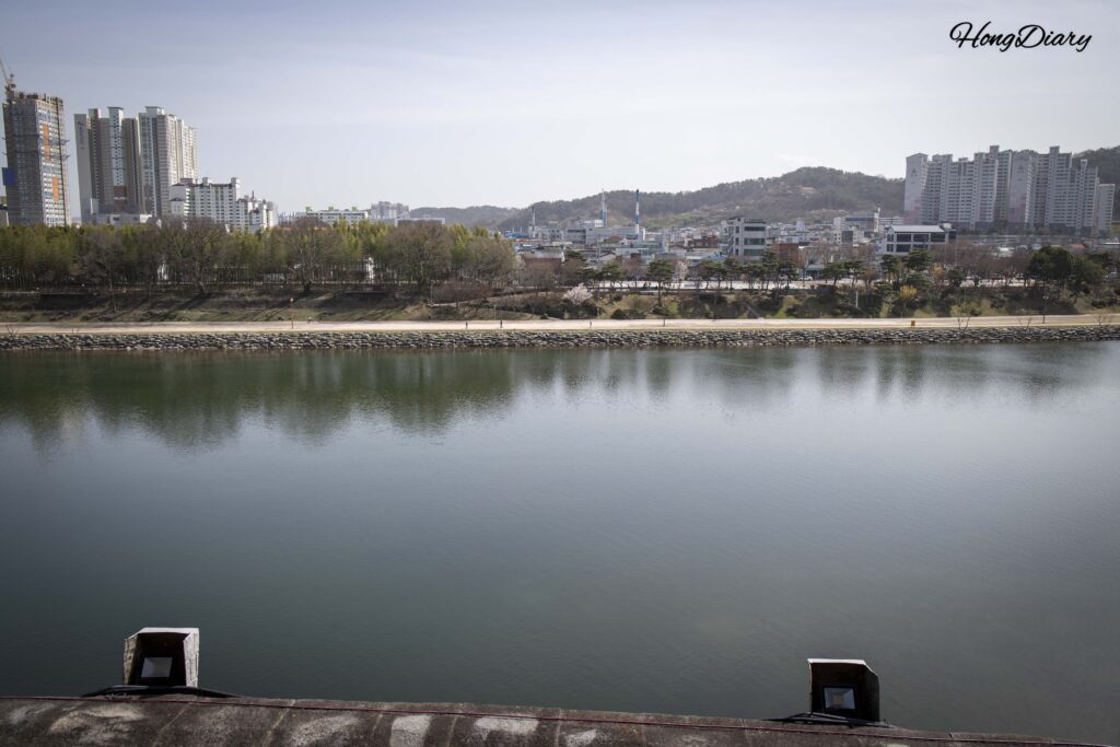 Daytime view of Namgang River from Chokseoknu Pavilion at Jinjuseong Fortress in Jinju