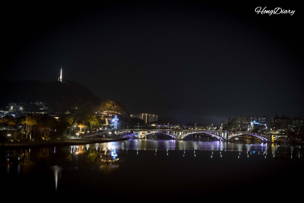 Namgang River at night with fortress wall reflections seen from Jinjuseong Fortress in Jinju