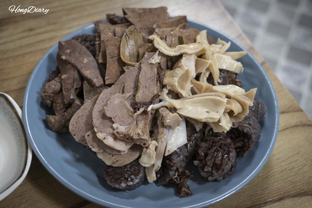Steamed pork liver and lung served alongside sundae at Oedong Chapssal Sundae in Seongdong Market Gyeongju