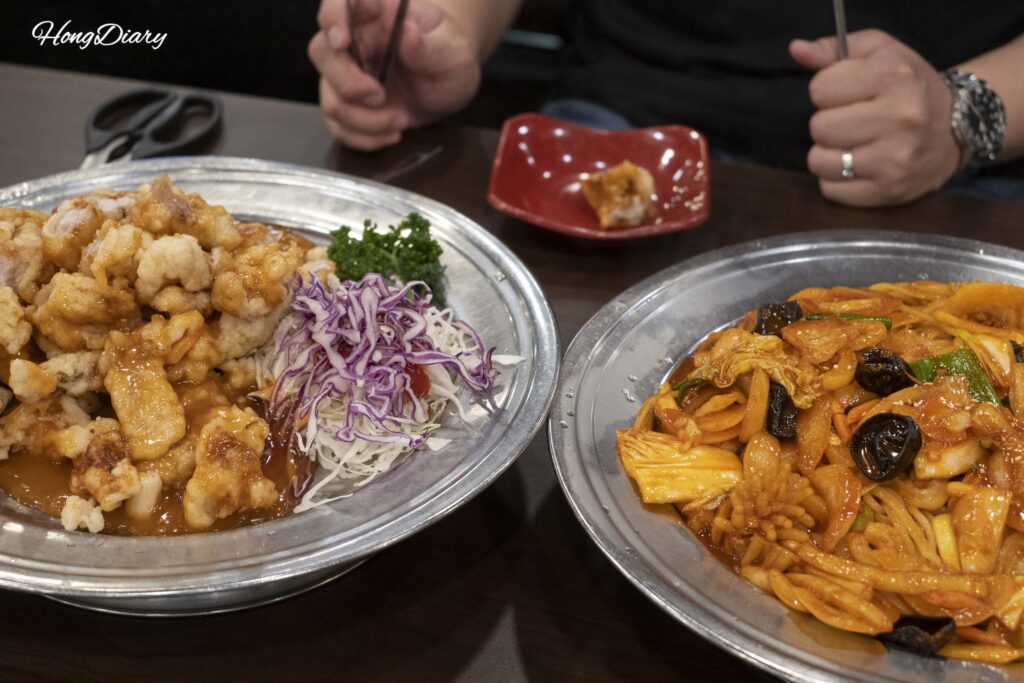 Tangsuyuk and yakiudon served together on the table at Rian restaurant in Daegu