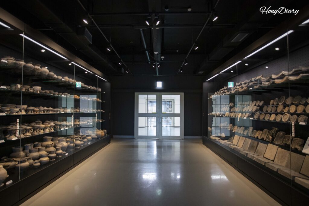 Artifacts stored in glass cases inside the open-storage Silla Millennium Treasure Archive at Gyeongju National Museum