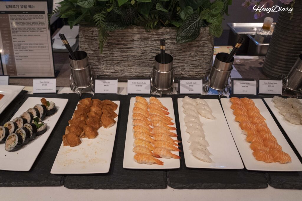 Sushi counter with salmon, shrimp, and squid nigiri at Ristorante, Hotel Nongshim Busan