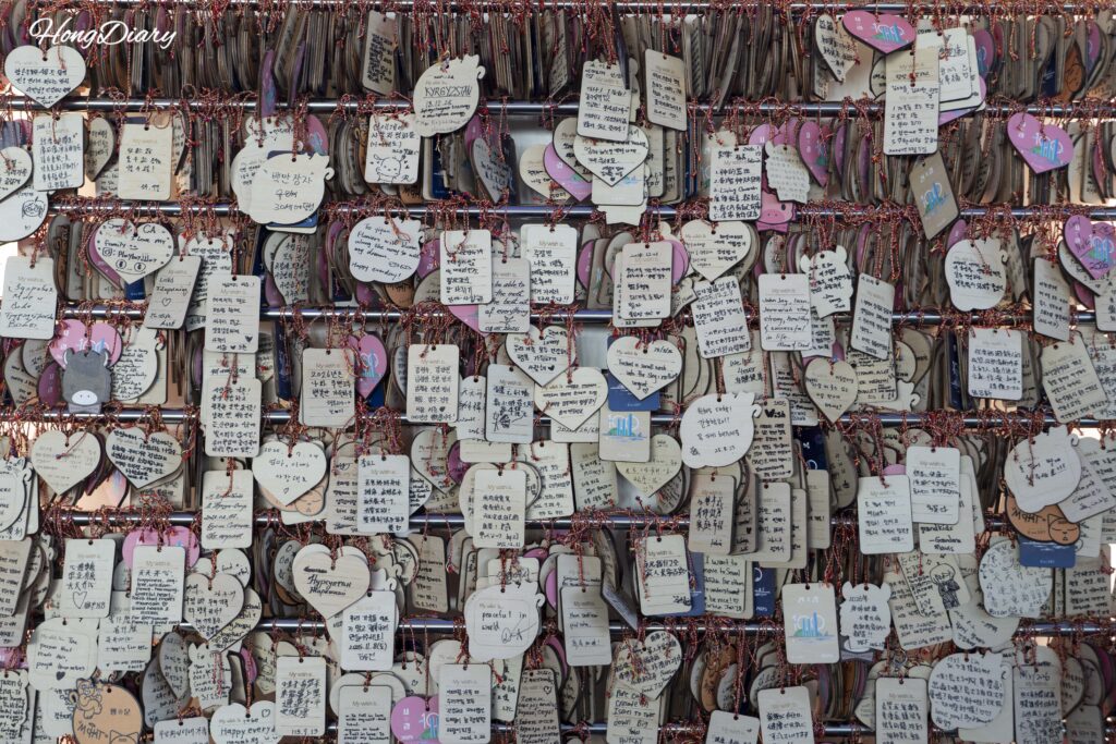 Wall of visitor wish cards written in multiple languages on the 99th floor of Busan X the Sky