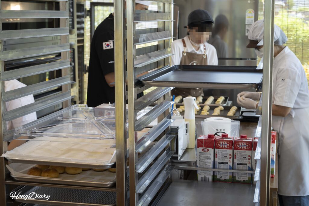 Bakers hand-shaping salt bread dough at Wolji Bread in Gyeongju