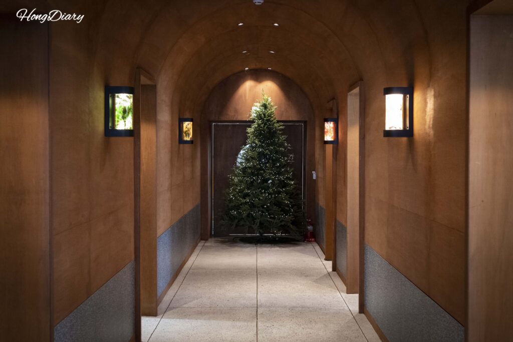 Arched corridor with herbarium signage at Yeoldudal Cafe Miryang