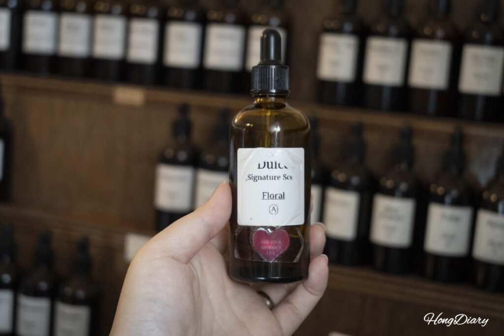 Close-up of a floral fragrance oil bottle selected during the ADoR perfume class