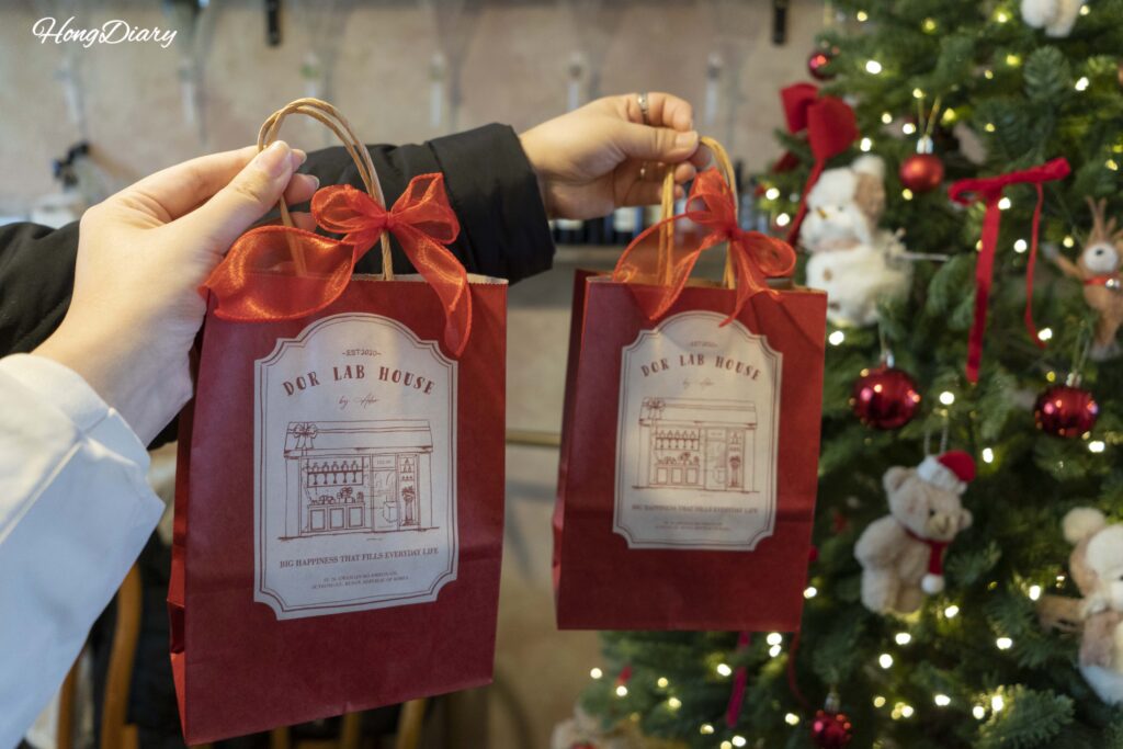 Completed custom perfume packaged in a gift bag at ADoR Gwangalli perfume workshop