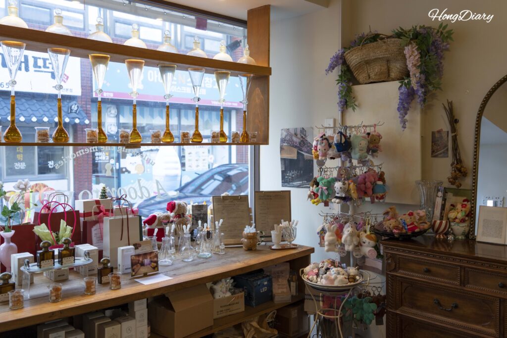 Interior of ADoR Gwangalli perfume workshop showing vintage-style decor and product displays
