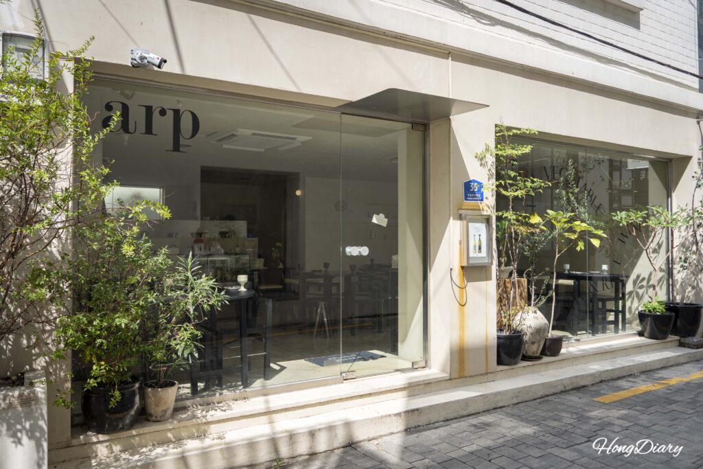 Entrance to ARP vegan restaurant on a quiet alley in Yeongdo, Busan