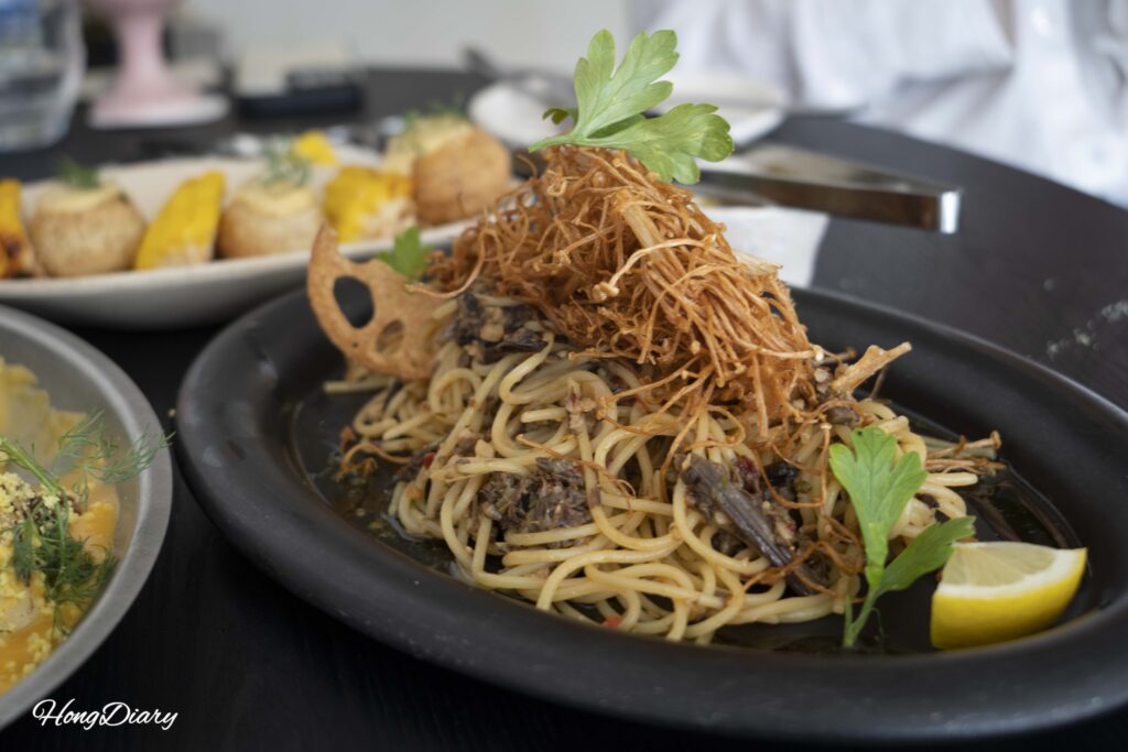 ARP signature bracken fern pasta with fried enoki mushroom and lotus root chips, a Michelin Bib Gourmand dish in Busan