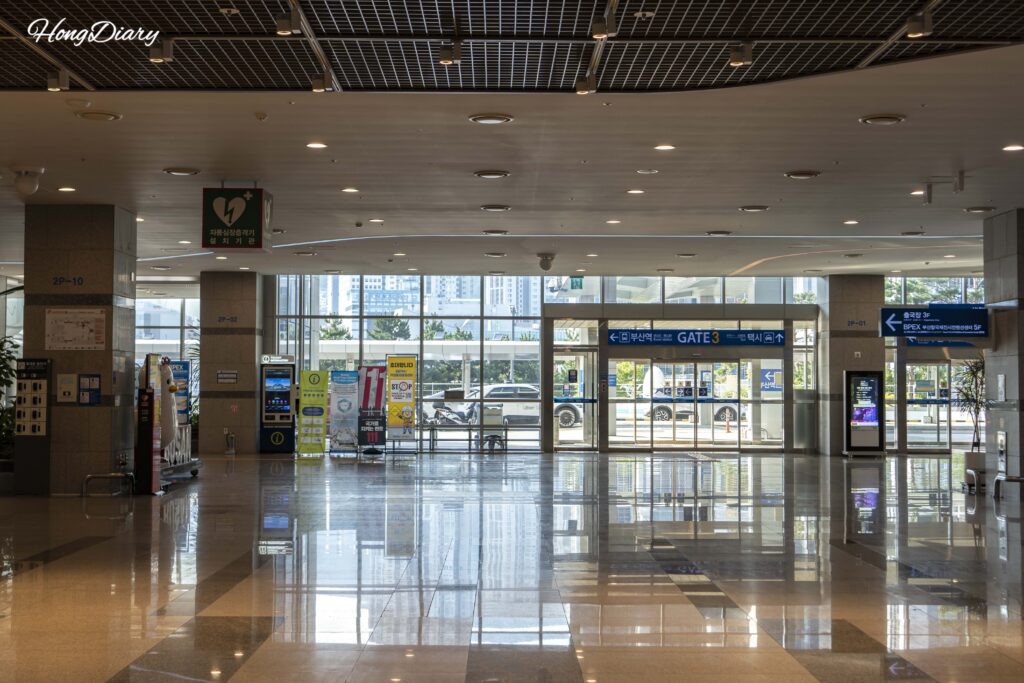 Interior view of the 2nd floor at Busan ferry terminal, showing Gate 3 and the spacious arrivals hall