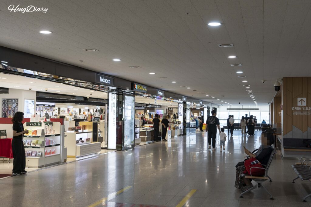 Passengers browsing the duty-free shop at Busan ferry terminal before boarding their ferry to Japan