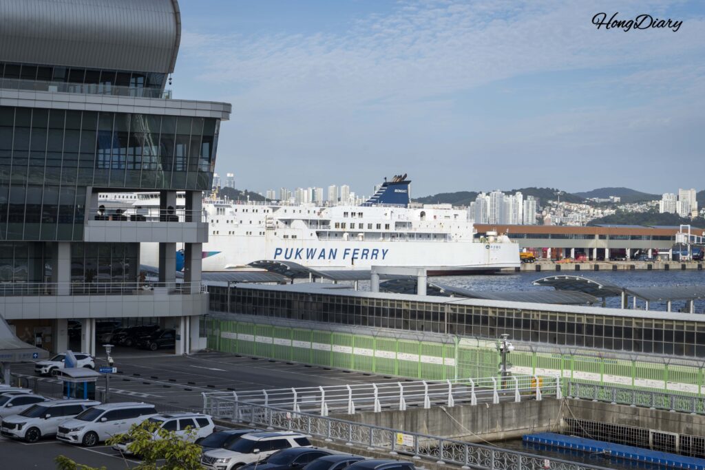 Daytime view of Busan International Ferry Terminal with a Pukwan Ferry ship docked at the port