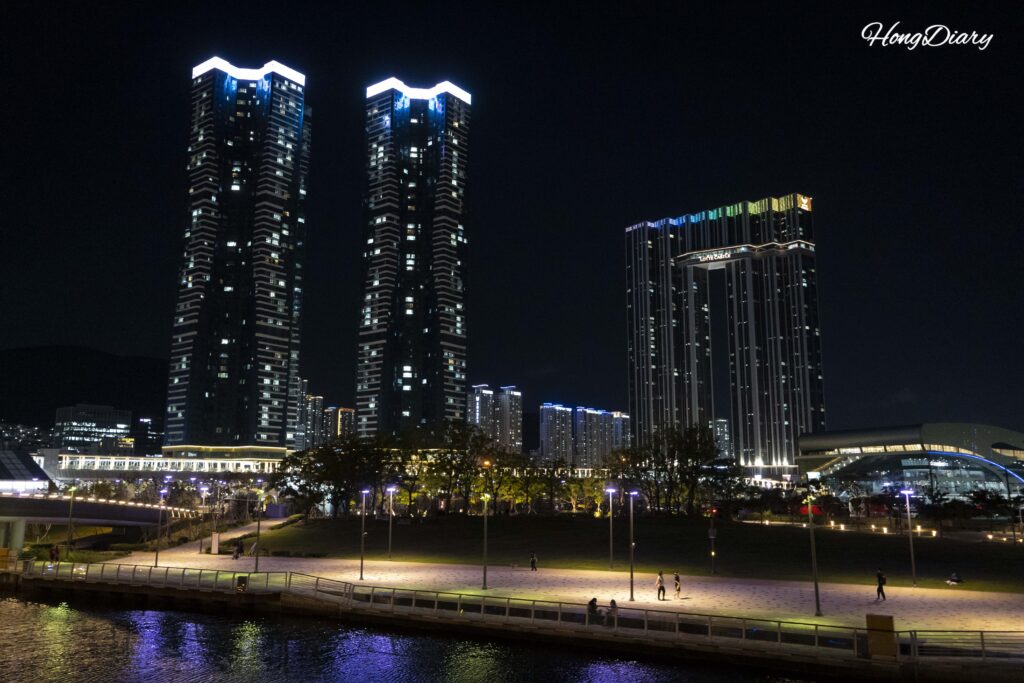 Photo spot at North Port Waterfront Park Busan with Hyeopseong Marina G7 and Lotte Castle de Mer high-rise towers and visitors walking nearby