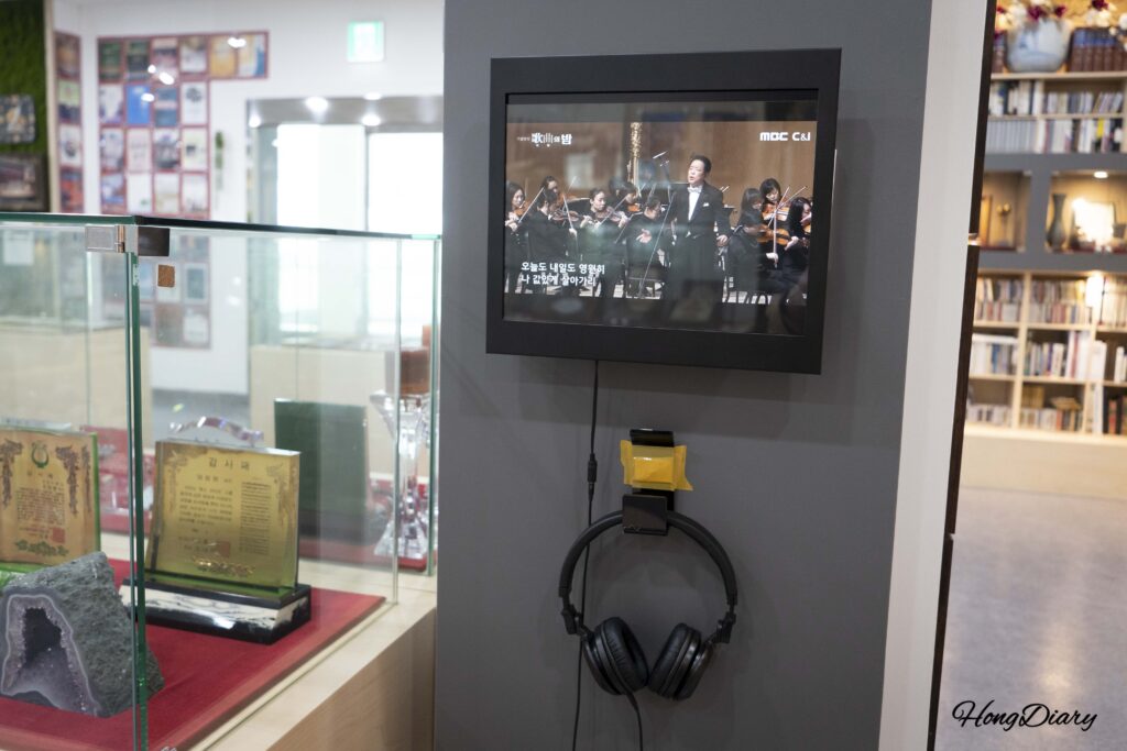 Video screens and headphone listening stations inside the Eom Jeong-haeng Museum at Ssangbyeokru Art Hall, Yangsan