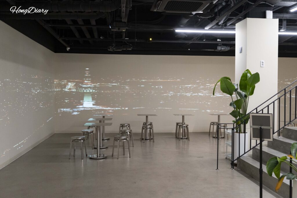 Stylish basement lounge area at Giverny Hotel Gyeongju with seating and dining space