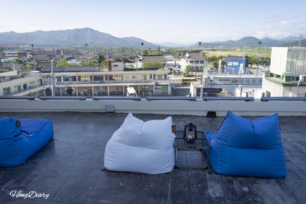 Rooftop terrace with outdoor seating at Giverny Hotel Gyeongju during daytime