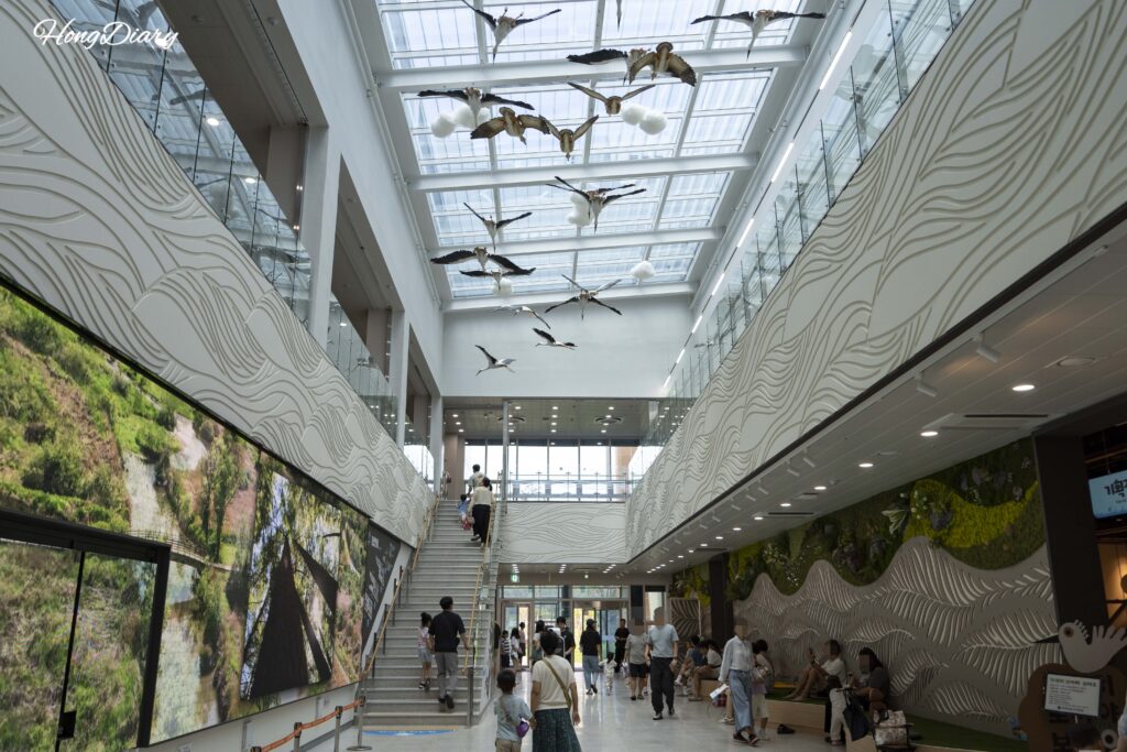 Open atrium interior of the Hwapocheon Wetland Science Museum with high ceilings and natural light in Gimhae