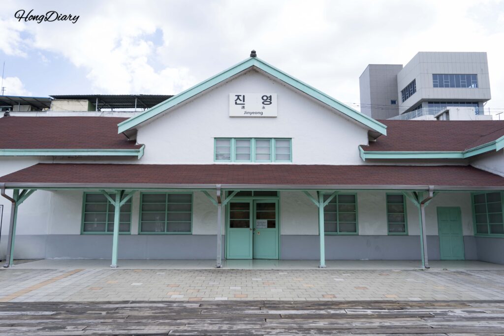 Exterior view of the mint-green 1943 Jinyeong Station building at Jinyeong Railway Museum in Gimhae, Korea