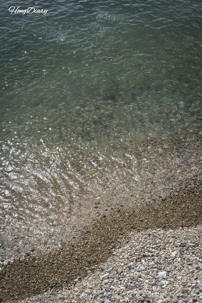 Clear turquoise ocean water at Jungni Beach in Yeongdo, Busan