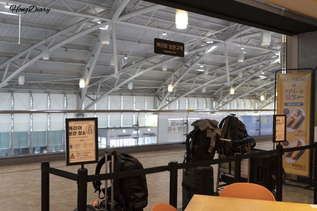 Luggage and suitcase storage area at the entrance of Plating food court in Gimhae Airport