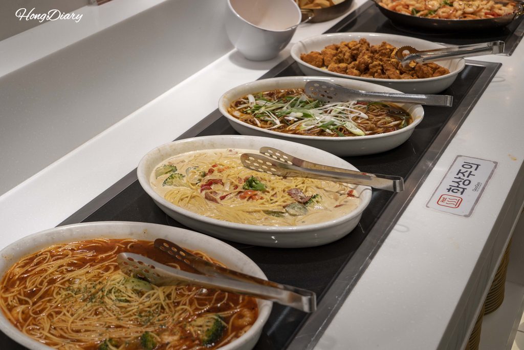 Pasta and noodle dishes at QooQoo buffet including jajangmyeon and rice noodles
