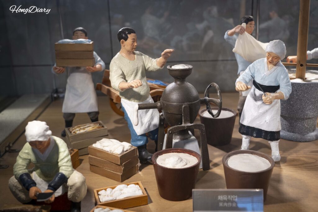 Miniature models showing traditional fish cake production methods at Samjin Fish Cake Yeongdo