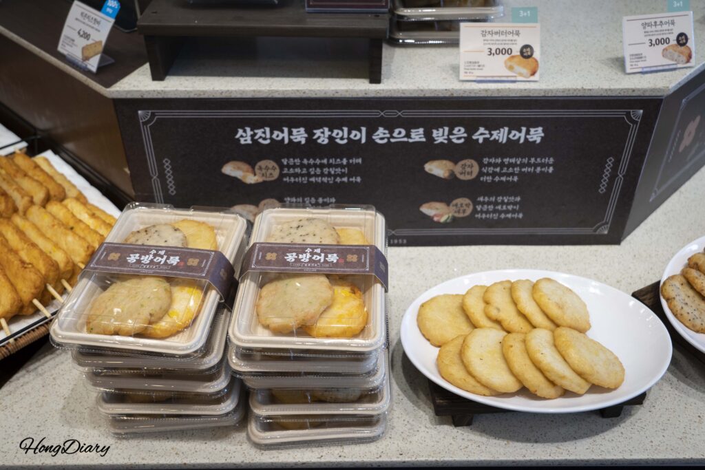 Potato butter fish cakes and assorted items on display at the Samjin Yeongdo flagship