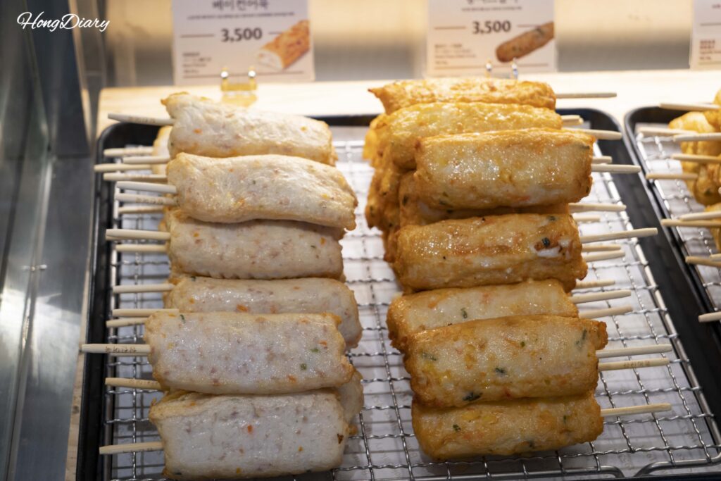 Skewer-style fish cakes with bacon, vegetables, and cheese fillings at Samjin Yeongdo