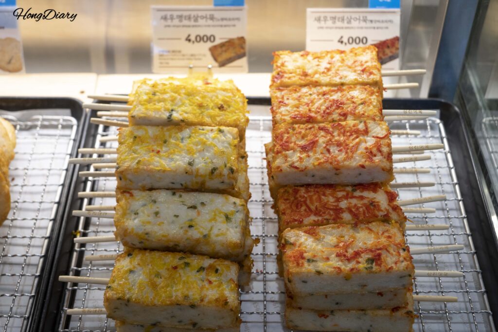 Shrimp and pollock fish cake skewers displayed at the Samjin flagship store