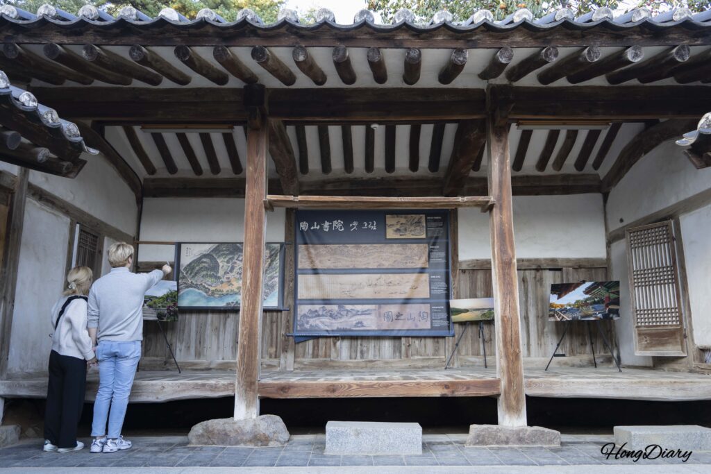 Sanggojiksa building and visitors walking through the courtyard at Dosan Seowon, Andong
