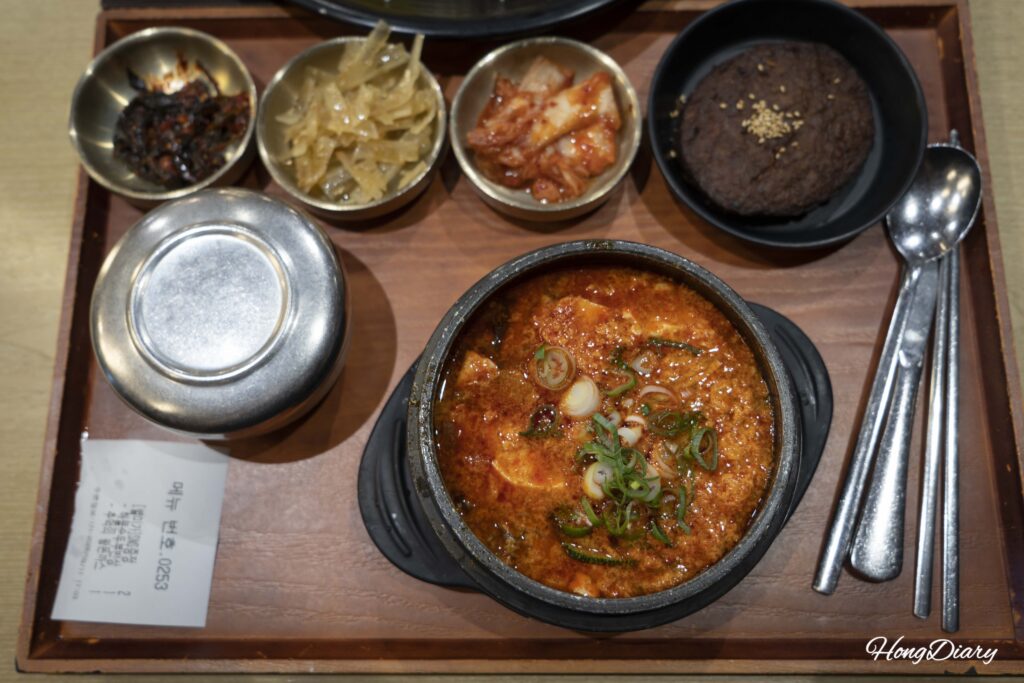 Seafood sundubu jjigae bansang set meal with banchan side dishes at Plating food court Gimhae Airport