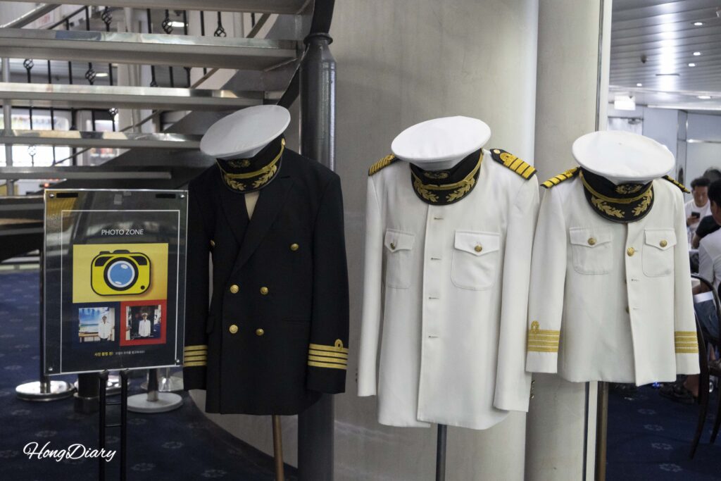 Photo zone on the Seonghee ferry where passengers can wear black and white captain uniforms