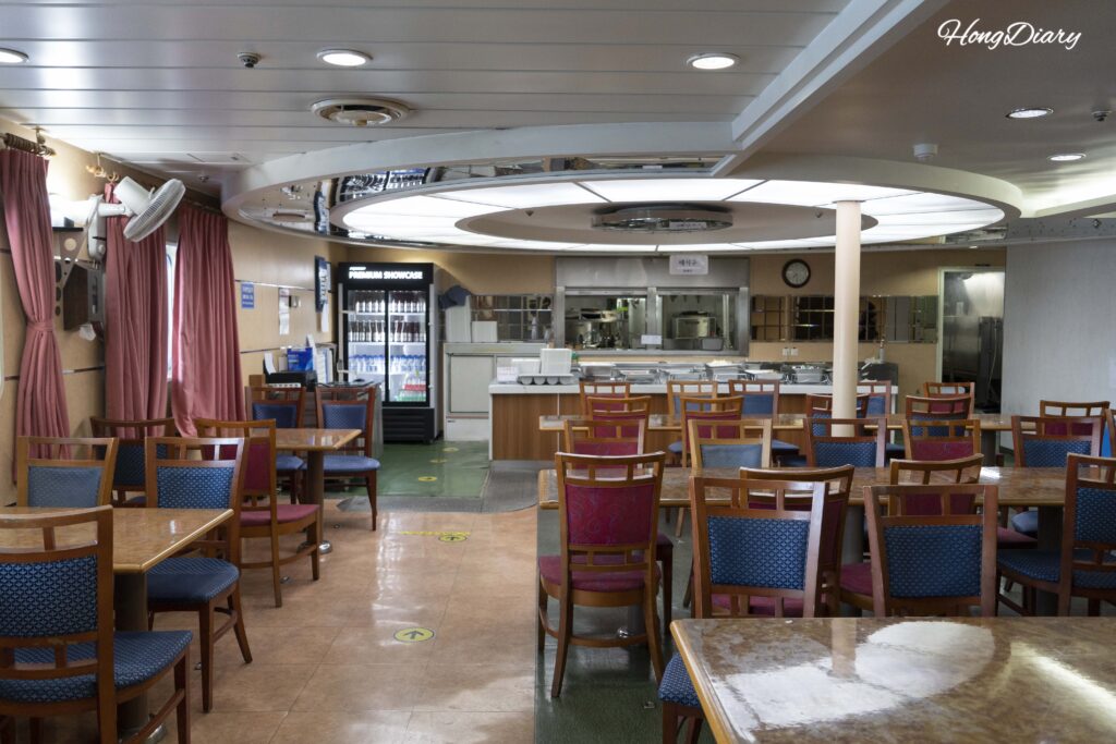 Interior of Restaurant Andamiro on Deck 5 of the Seonghee ferry with seating and kiosk
