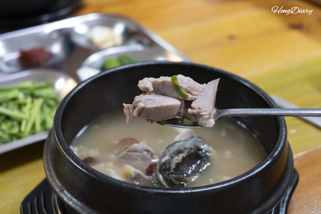 Thick-cut pork slices in the Donsamjeonboktang (pork ginseng abalone soup) at Seonjeongmun Dwaeji Gukbap in Busan