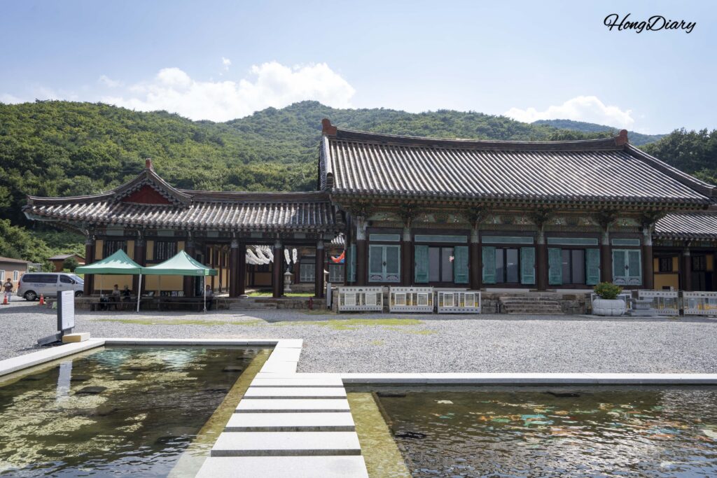 Panoramic view of Seounam Hermitage buildings and courtyard nestled on the slope of Mt. Yeongchuksan in Yangsan