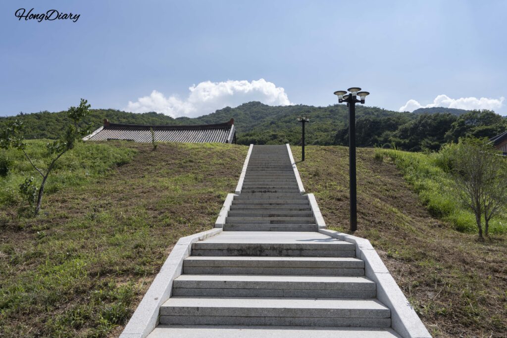 Stone steps leading uphill from Tongdosa Temple to Seounam Hermitage through a forested mountain path in Yangsan