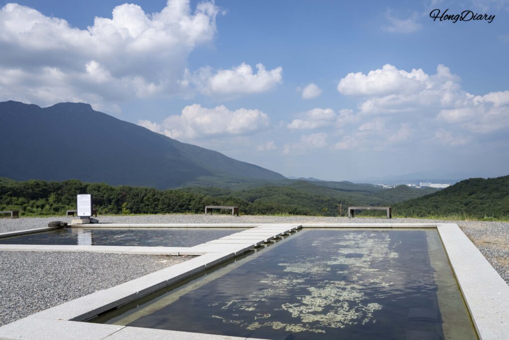 Najeon otchil (mother-of-pearl lacquer) reproduction of the Ulju Cheonjeon-ri petroglyphs submerged in a water basin at Seounam Hermitage