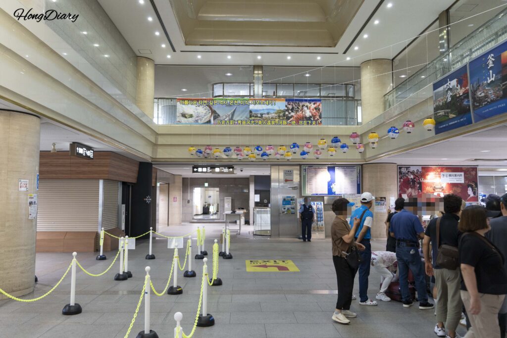 Inside the second floor of Shimonoseki Port International Terminal with arriving ferry passengers