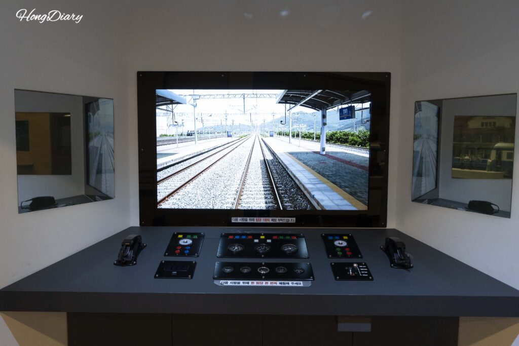 Train conductor simulator experience at Jinyeong Railway Museum using real Mugunghwa-ho footage