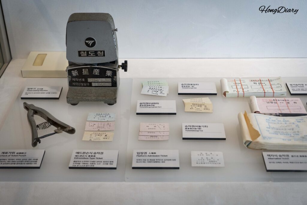 Vintage Korean train tickets and ticket punch tools displayed at Jinyeong Railway Museum Exhibition Hall 1