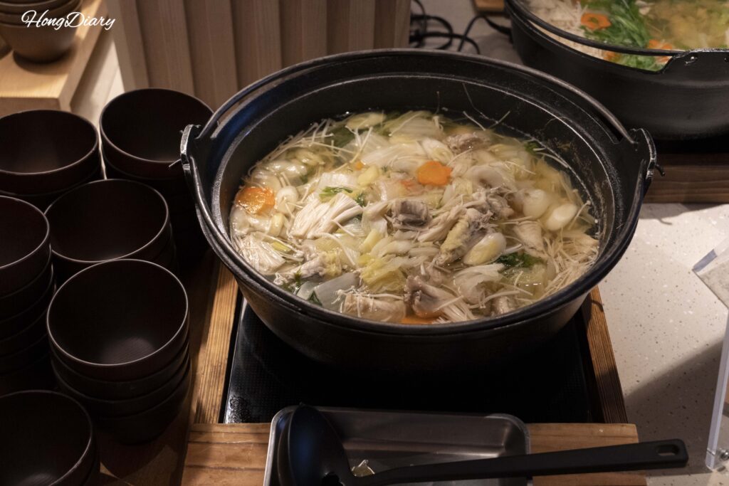 Fugu nabe hot pot with carrots, mushrooms, and green onions at PUKU PUKU buffet