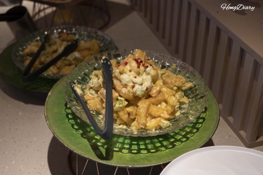 Chinese-inspired fried dish with mustard sauce at the hot food section in PUKU PUKU