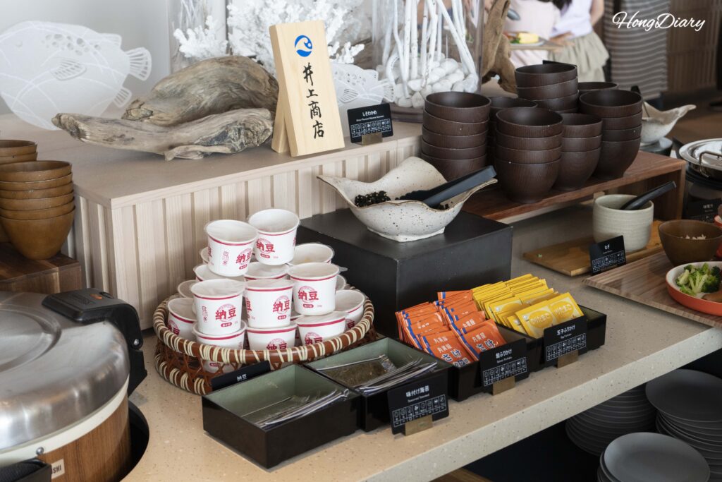 Japanese breakfast staples — nori, natto, furikake, and a rice cooker at PUKU PUKU
