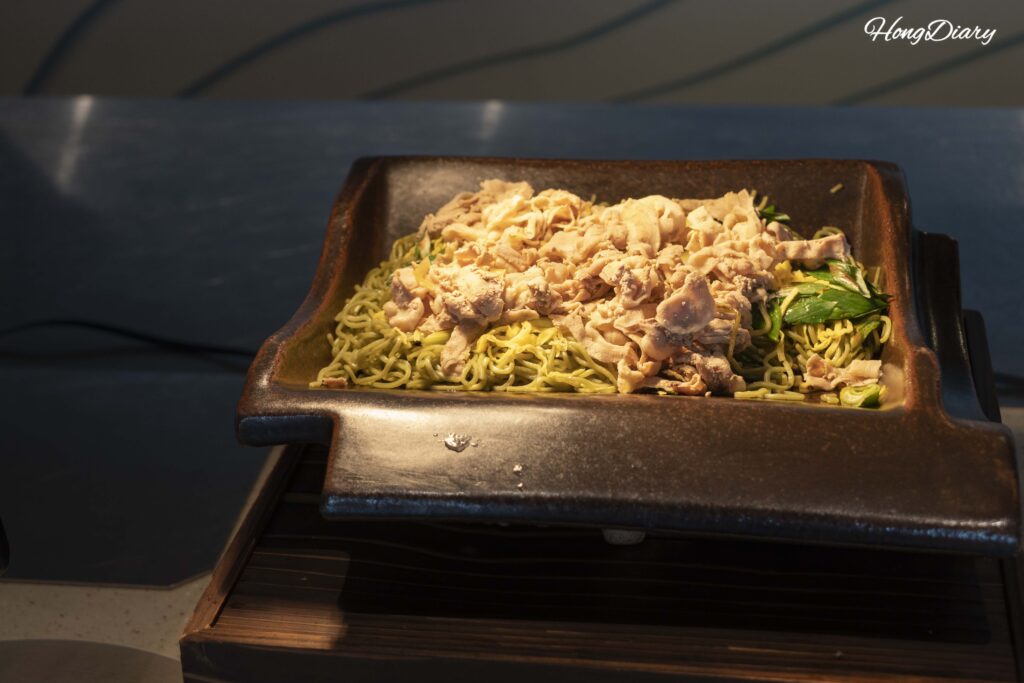 Close-up of kawara soba — buckwheat noodles on a heated roof tile, a Yamaguchi regional specialty at PUKU PUKU