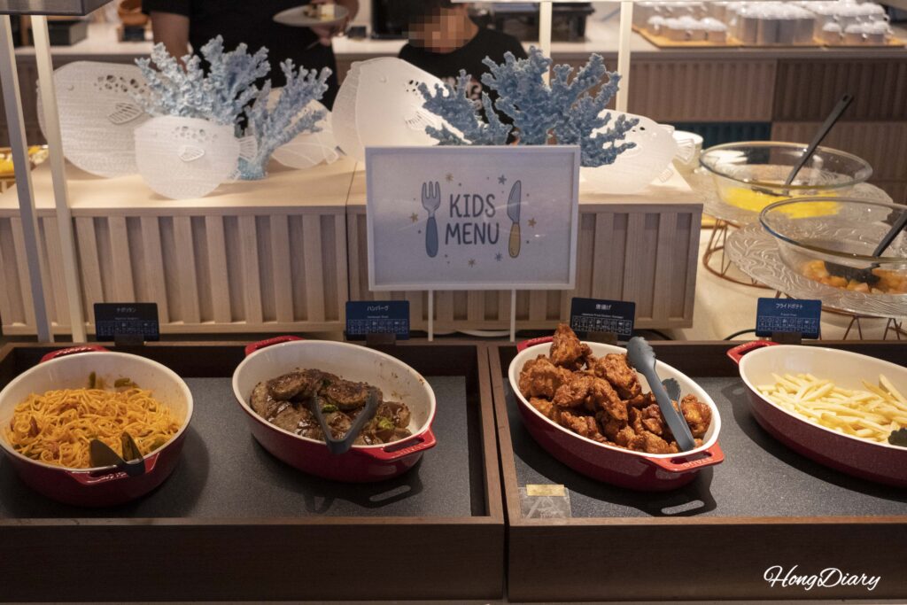 Kids menu section with spaghetti, hamburg steak, and karaage next to a paper fugu decoration at PUKU PUKU