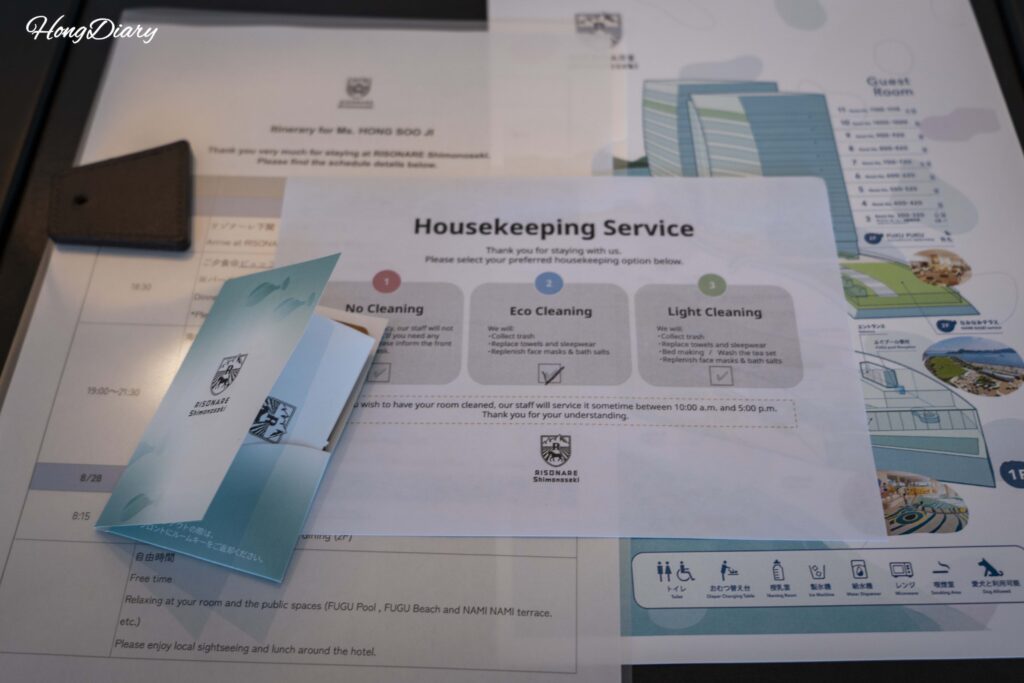 Room key card, guest guidelines, and housekeeping service selection form at RISONARE Shimonoseki by Hoshino Resorts